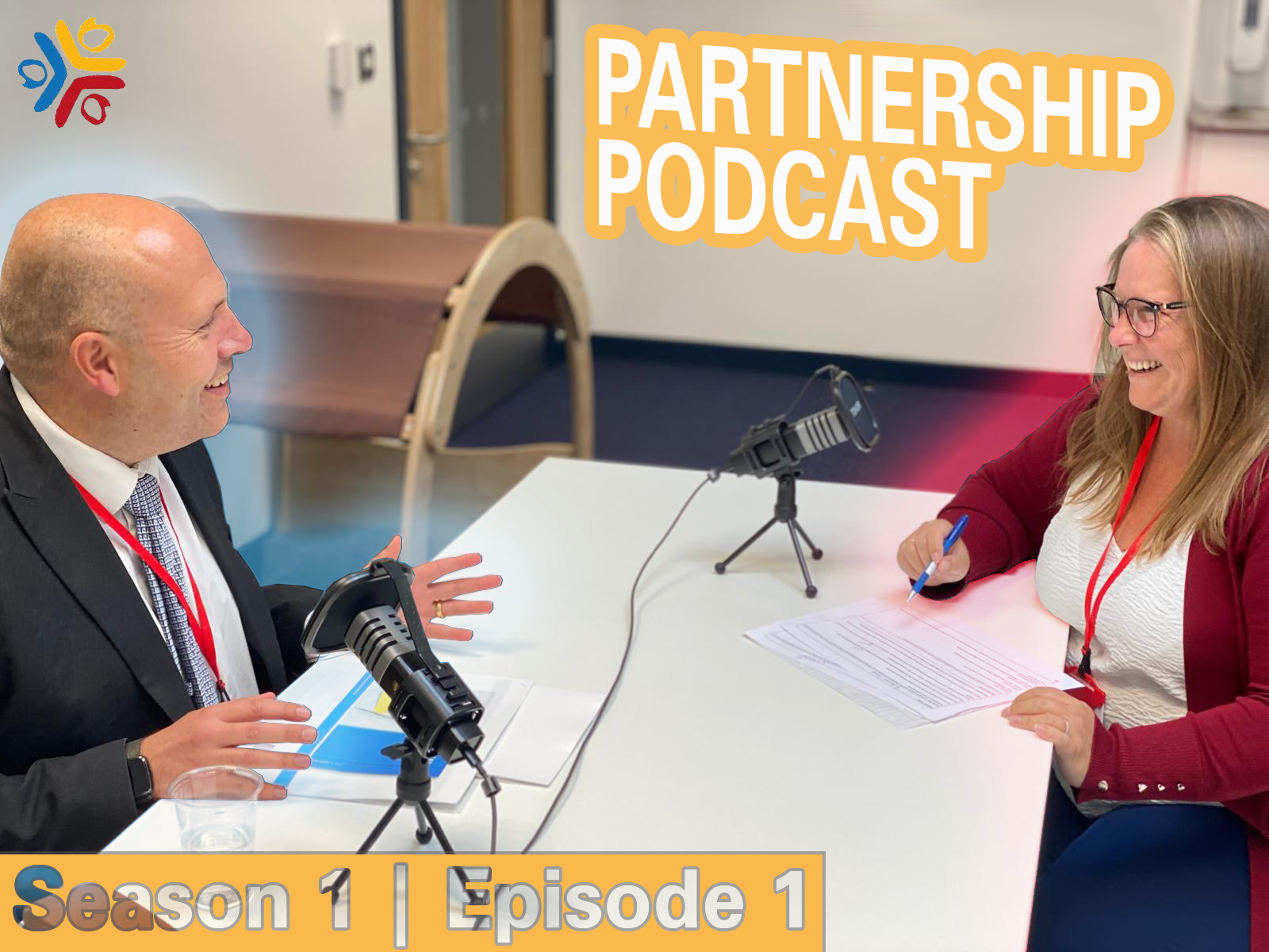 The Partnership Podcast Episode 1 - Sam and Jenn sitting at a table